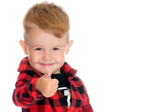 Un niño está levantando un dedo . —  Fotos de Stock