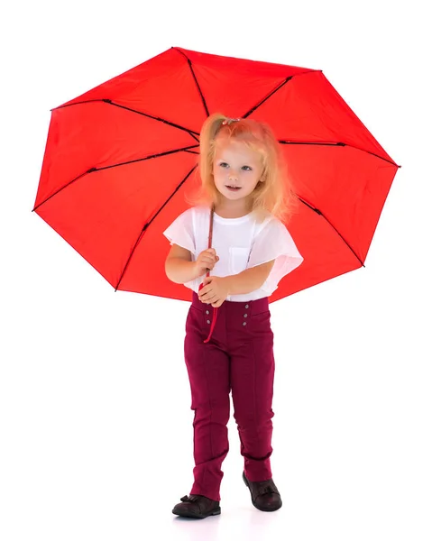 Little girl under an umbrella. — Stock Photo, Image