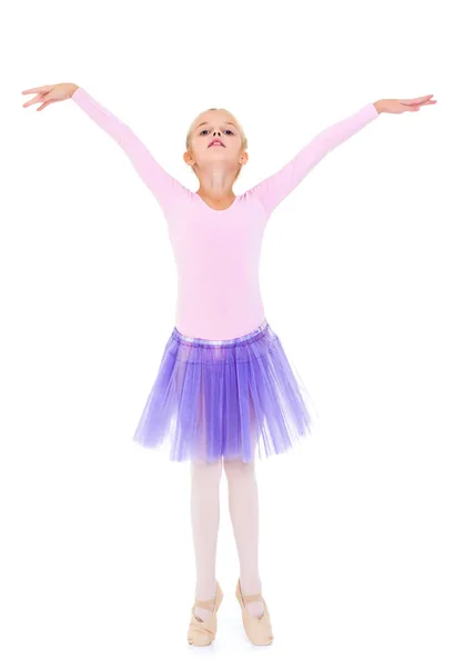 Little girl ballerina performs dance. — Stock Photo, Image