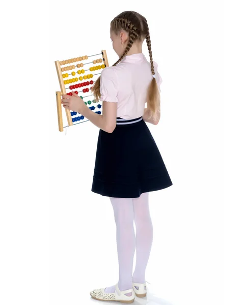 The girl counts on abacus — Stock Photo, Image