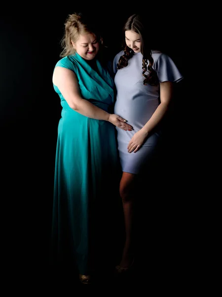 Young pregnant girl with mother — Stock Photo, Image