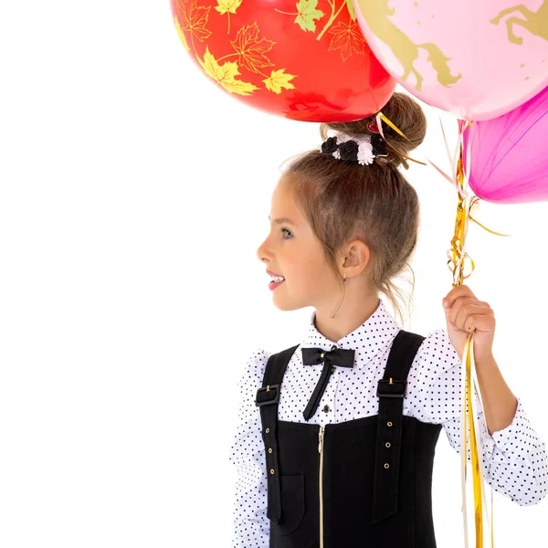 Маленька дівчинка з гелієвими кульками . — стокове фото