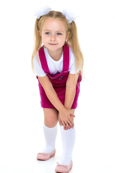 Little girl posing in studio on a white background. Stock Photo