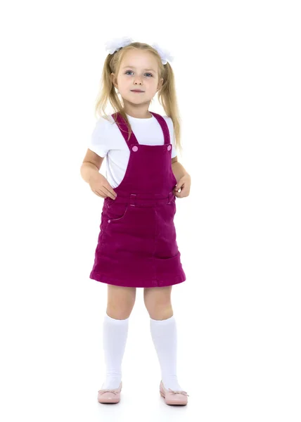 Niña posando en el estudio sobre un fondo blanco. — Foto de Stock