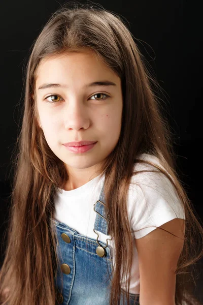 Little girl on a black background — Stock Photo, Image