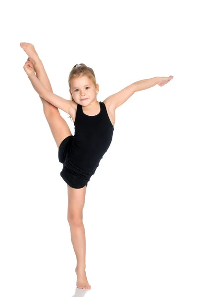 La gimnasta se equilibra en una pierna . —  Fotos de Stock