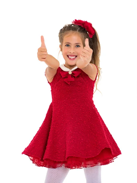 Klein meisje houdt haar duim omhoog — Stockfoto