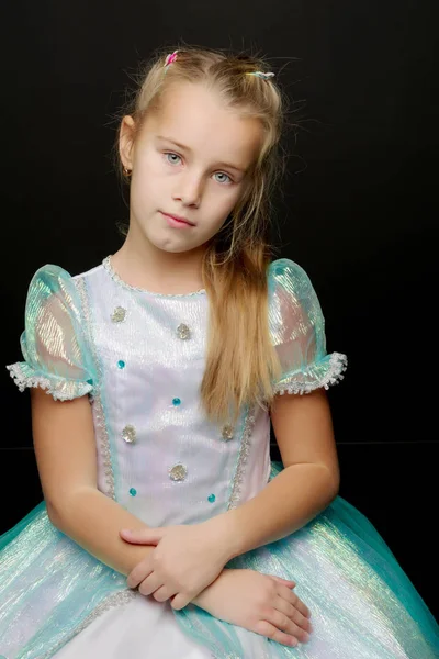 Little little girl studio portrait on a black background. Close- — Stock Photo, Image