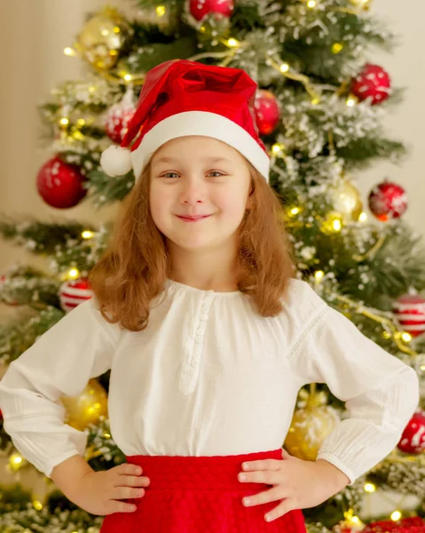 The girl at the Christmas tree. — Stock Photo, Image