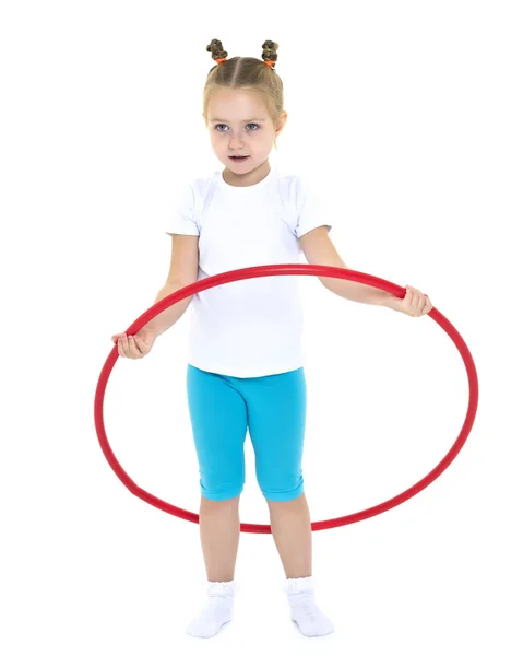 The little girl turns the hoop. — Stock Photo, Image