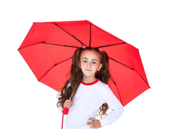 Kleines Mädchen unter einem Regenschirm. — Stockfoto