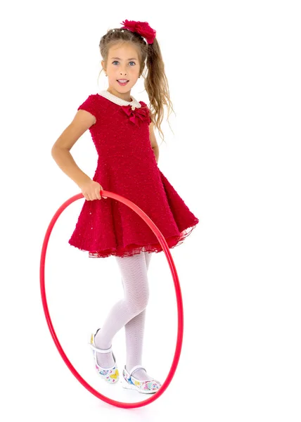 The little girl turns the hoop. — Stock Photo, Image