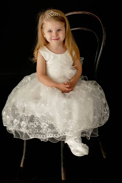 Little girl on a black background — Stock Photo, Image