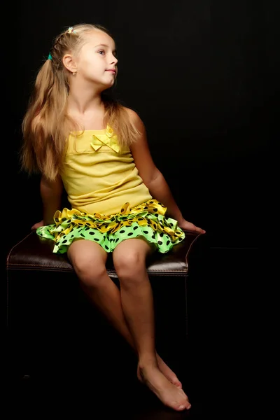 Little girl on a black background — Stock Photo, Image