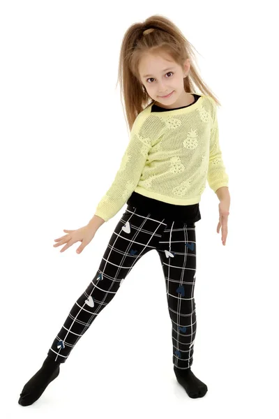 A cheerful little girl is dancing. — Stock Photo, Image