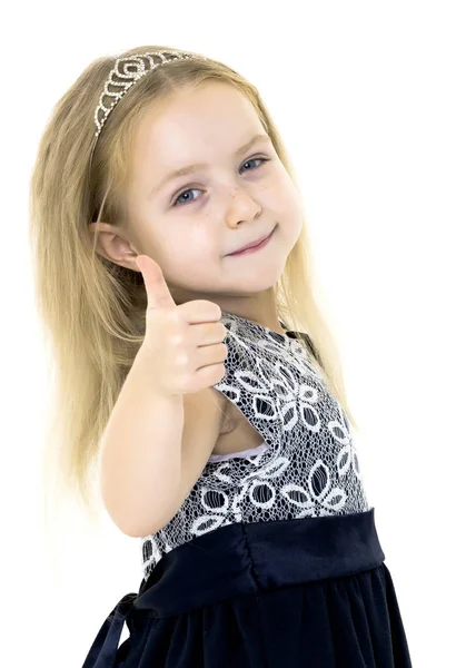 Little girl holding her thumb up Stock Image