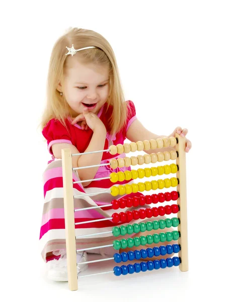 The girl counts on abacus Royalty Free Stock Images