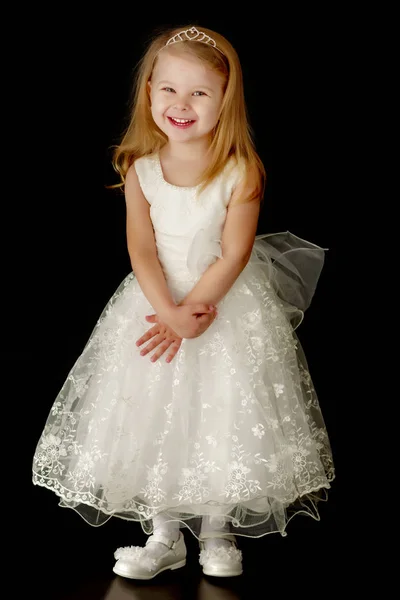Little girl on a black background Stock Picture