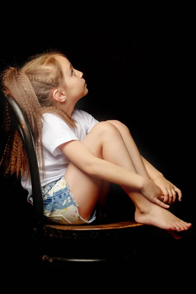 Little girl on a black background — Stock Photo, Image