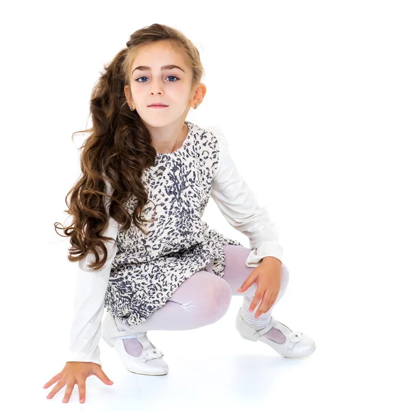 Little girl is sitting on the floor. — Stock Photo, Image