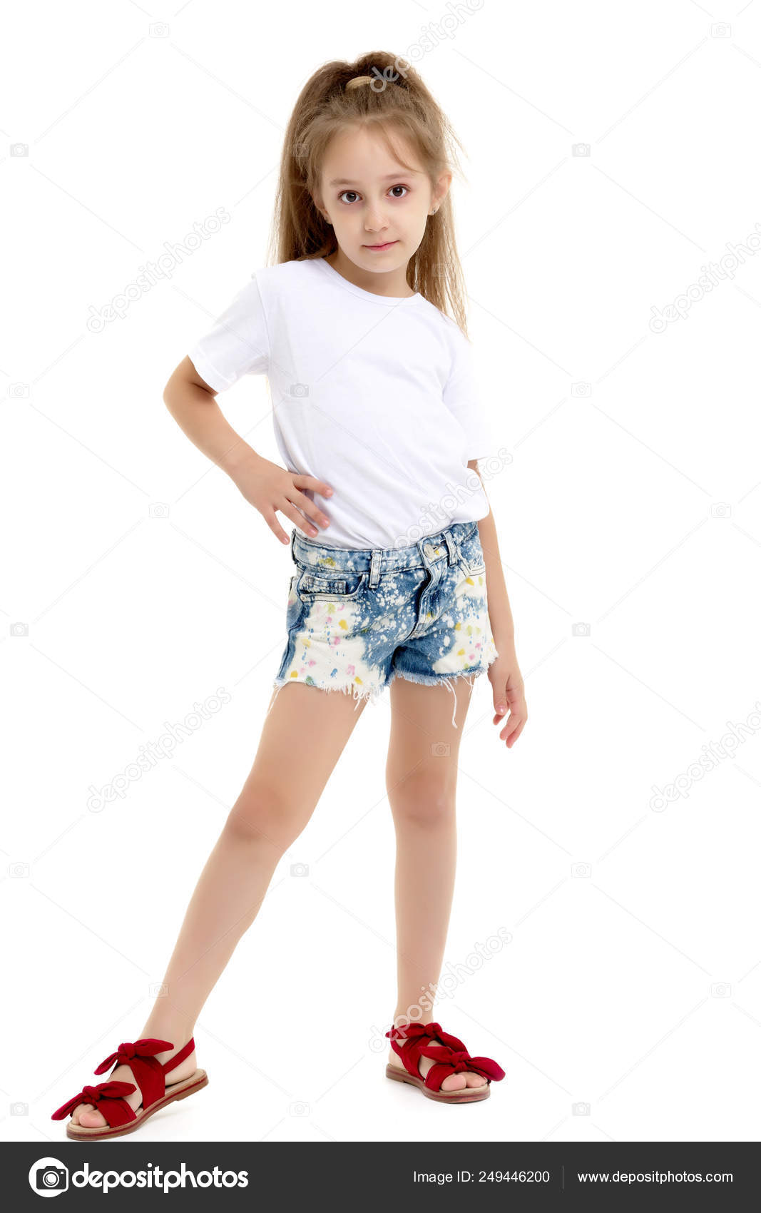 Little girl in a pure white t-shirt for advertising and shorts. Stock Photo  by ©lotosfoto1 249446200