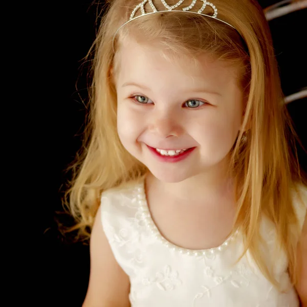 Little girl on a black background — Stock Photo, Image