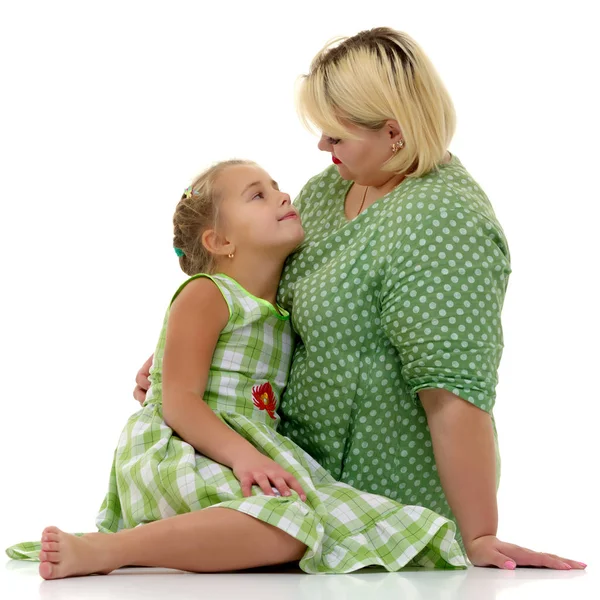 Mom and little daughter studio portrait on a white background. — Stock Photo, Image