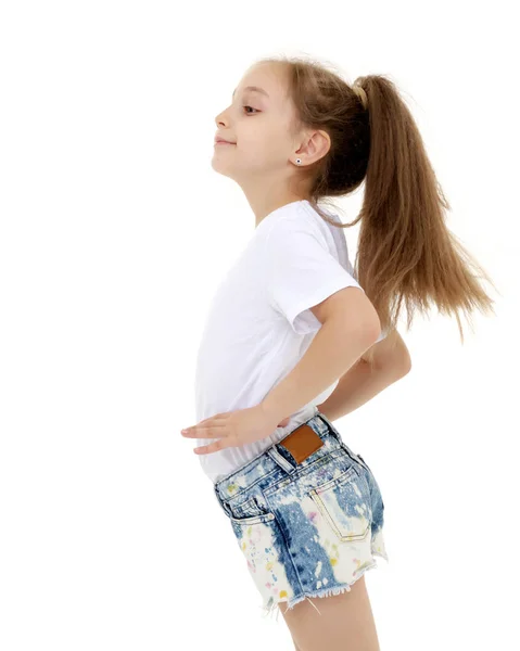 Charming girl in a pure white t-shirt for advertising and shorts — Stock Photo, Image