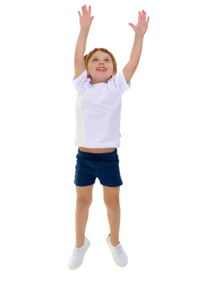 Un niño pequeño con una camiseta blanca limpia está saltando divertido . —  Fotos de Stock