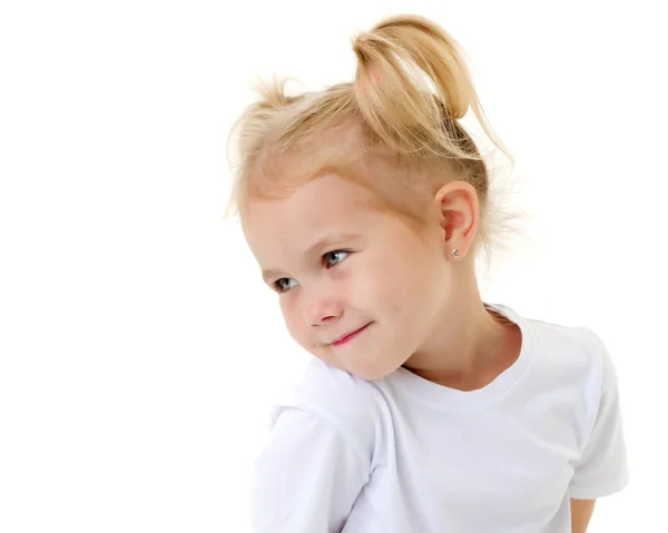 Una bambina con una t-shirt bianca. Fotografia Stock