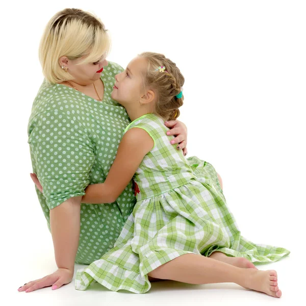 Mom and little daughter studio portrait on a white background. — Stock Photo, Image