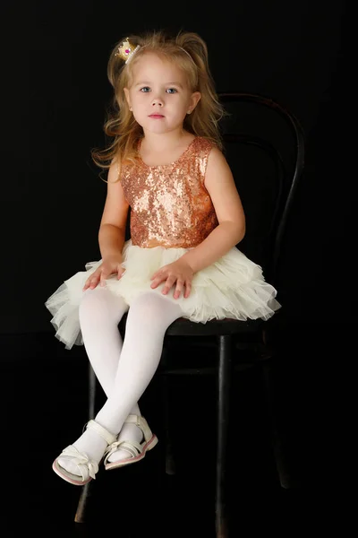 Little girl on a black background — Stock Photo, Image