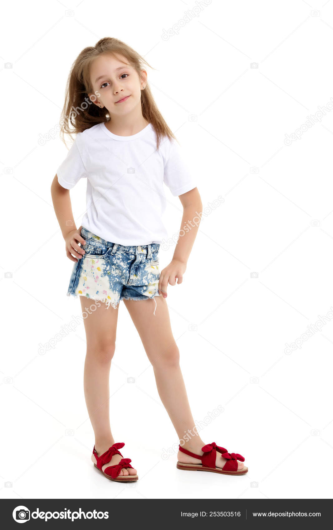 Little girl in a pure white t-shirt for advertising and shorts. Stock Photo  by ©lotosfoto1 253503516