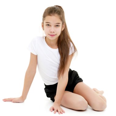 Jimnastikçi egzersizi yapmaya hazırlanıyor..