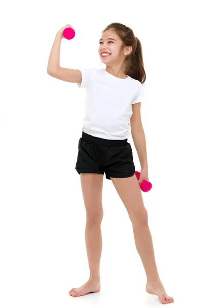 Teenage girl with dumbbells in hands — Stock Photo, Image