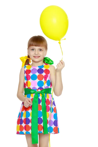 Little girl with a balloon. — Stock Photo, Image