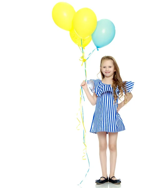 Adorable little blond girl in very short summer striped dress. — Stock Photo, Image
