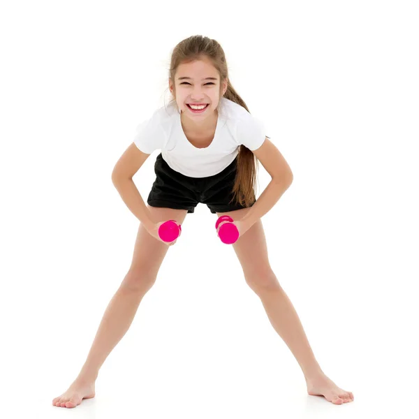 Tiener meisje met halters in de handen — Stockfoto