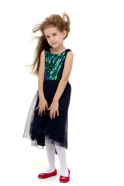 Little girl in a dress developing in the wind. — Stock Photo, Image