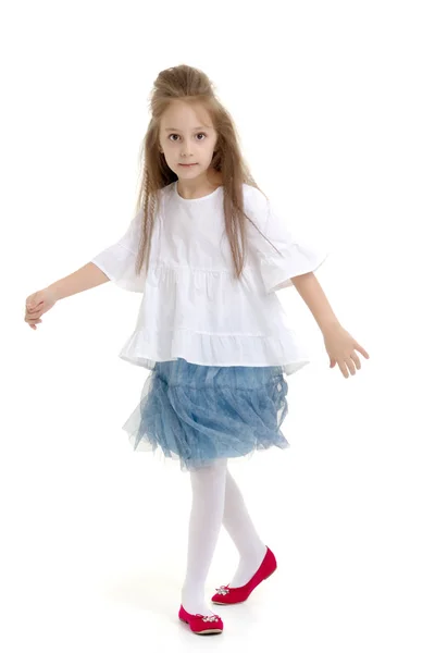 Little girl ballerina performs dance. — Stock Photo, Image