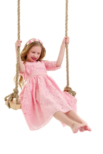 Little girl swinging on a swing — Stock Photo, Image