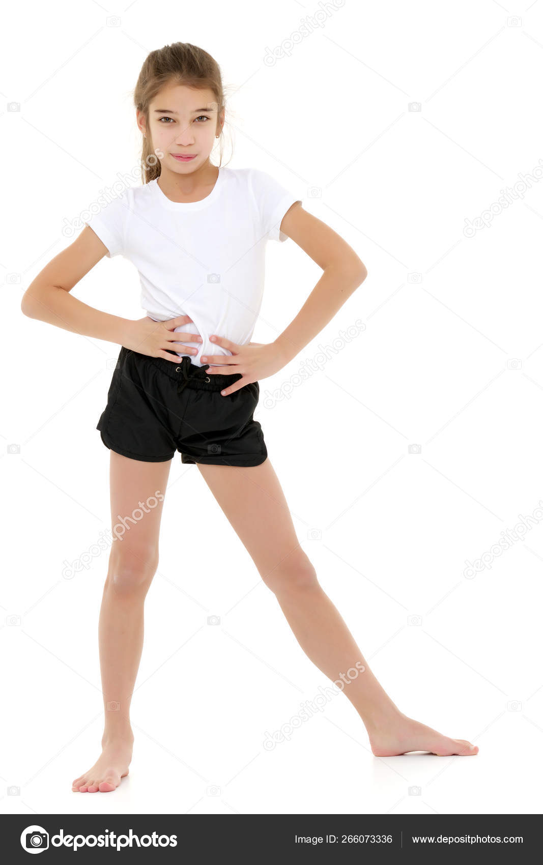 Little girl in a pure white t-shirt for advertising and shorts. Stock Photo  by ©lotosfoto1 266073336