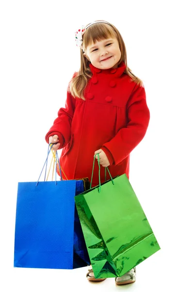 Bambina con le borse della spesa . — Foto Stock