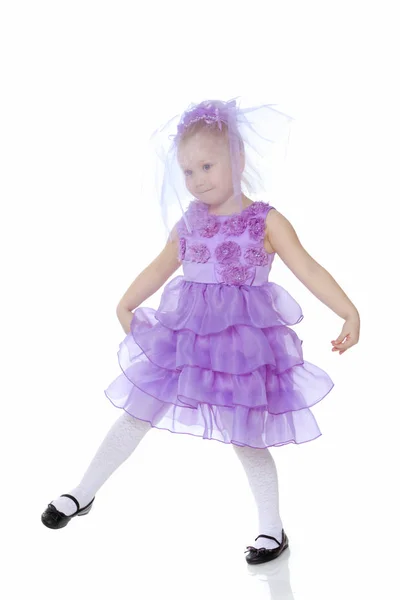 Little girl in purple dress. — Stock Photo, Image