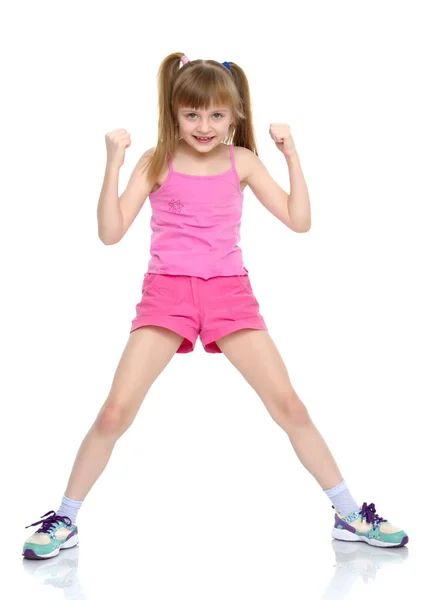 Uma menina mostra seus músculos . — Fotografia de Stock