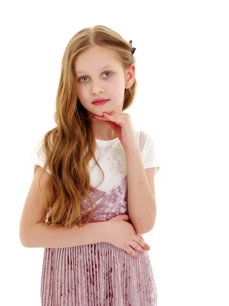 A nice little girl thinks. — Stock Photo, Image