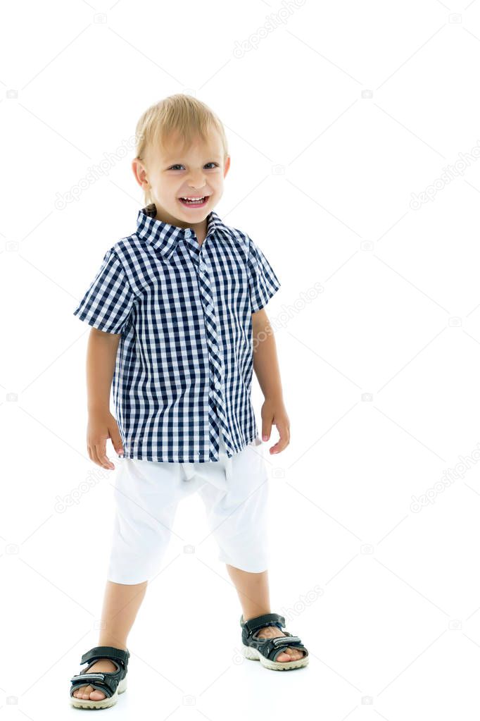 Handsome little boy in full growth on a white background. The co