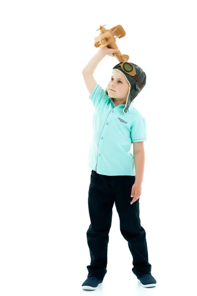 Little boy playing with wooden plane — Stock Photo, Image