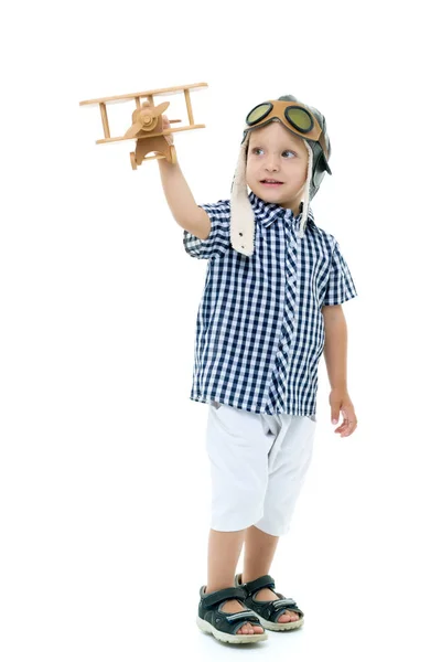Little boy playing with wooden plane — Stock Photo, Image
