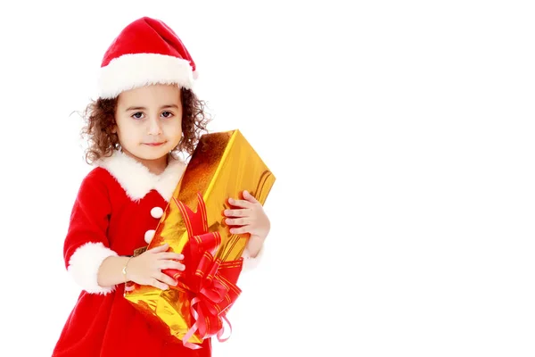 Menina no traje de Papai Noel com presente — Fotografia de Stock